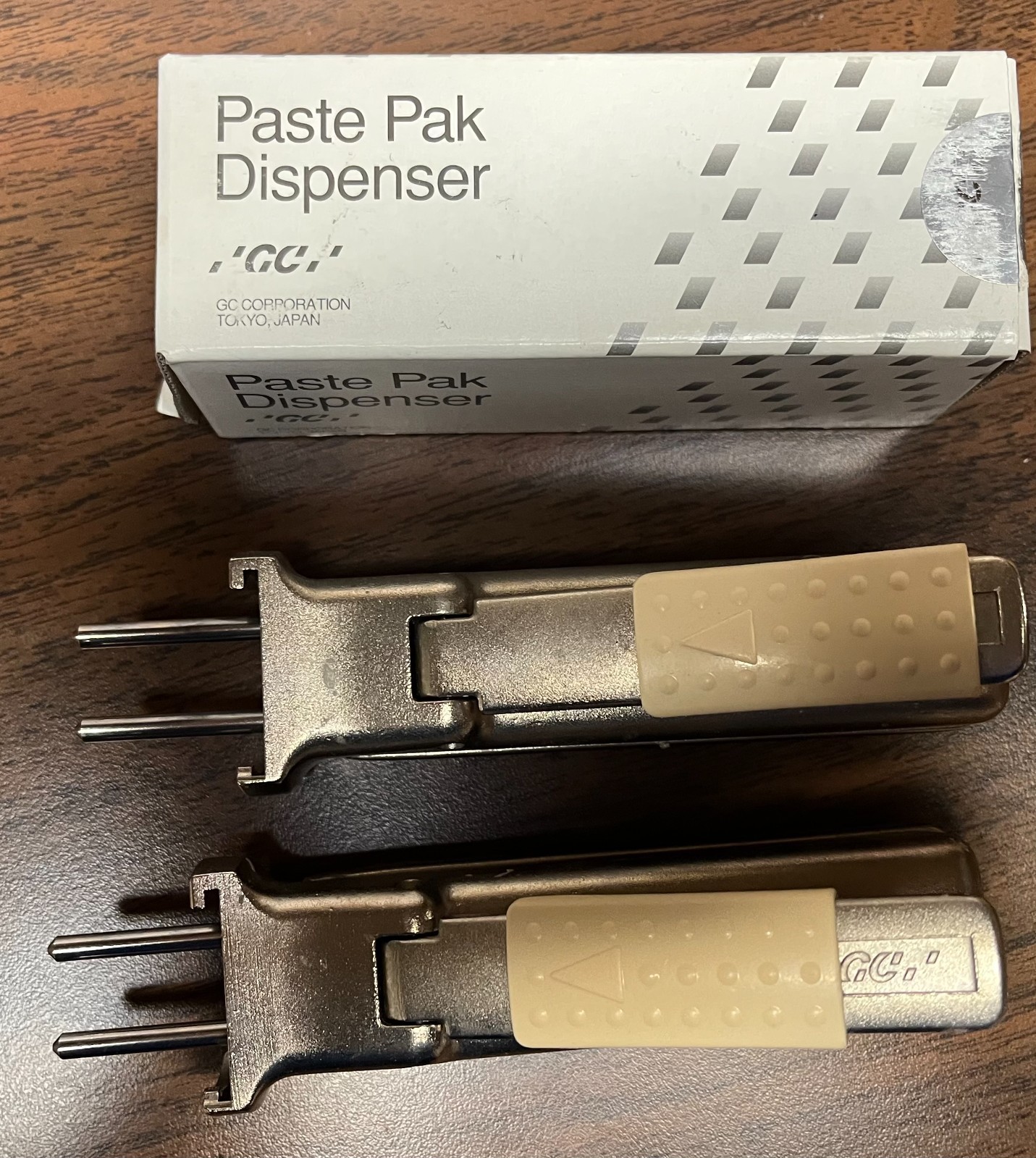 Three GC Paste Pak Dispensers 2 used and 1 new in box