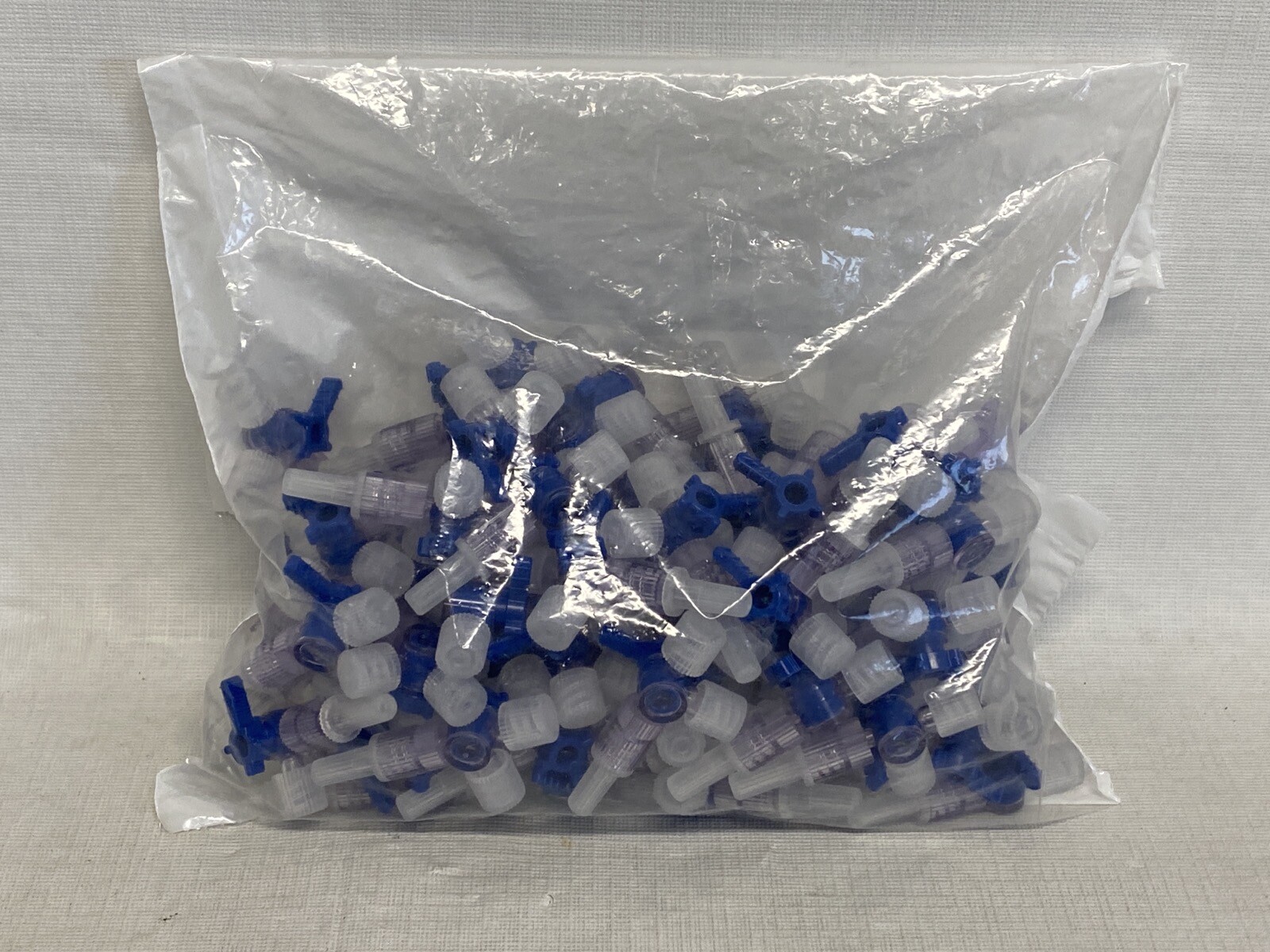 (73) VALUE PLASTICS Four-Way Stopcock Capped F Luer to Capped M Luer-Lock